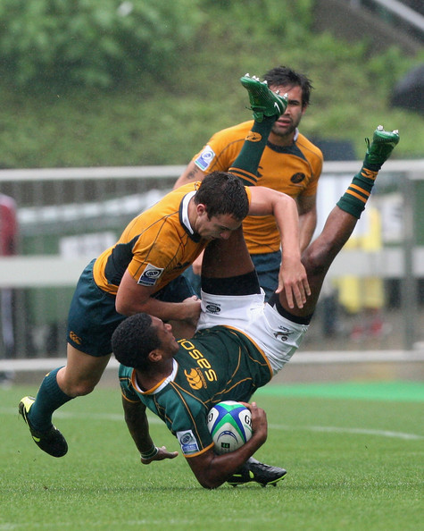 Sampie Mastriet of South Africa is tackled by Nicholas White of Australia during the IRB Junior World Championship Japan 2009 Third Place Play Off between South Africa and Australia at Prince Chichibu Stadium on June 21, 2009 in Tokyo, Japan. (June 21, 2009 - Photo by Junko Kimura/Getty Images AsiaPac) 