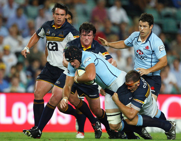 Chris Thomson of the Waratahs is tackled during a Super 14 trial match between the Waratahs and the Brumbies at Sydney Football Stadium on February 5, 2009 in Sydney, Australia (February 5, 2009 - Photo by Cameron Spencer/Getty Images AsiaPac) 